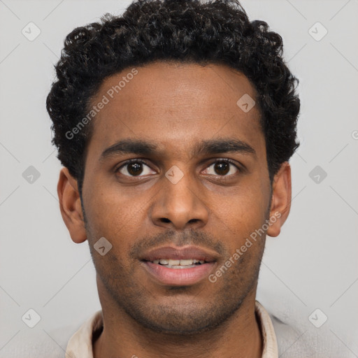 Joyful black young-adult male with short  brown hair and brown eyes