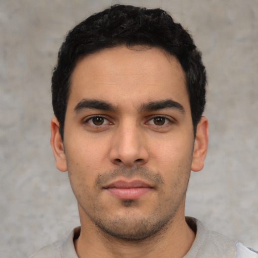 Neutral latino young-adult male with short  black hair and brown eyes