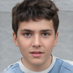 Joyful white child male with short  brown hair and brown eyes