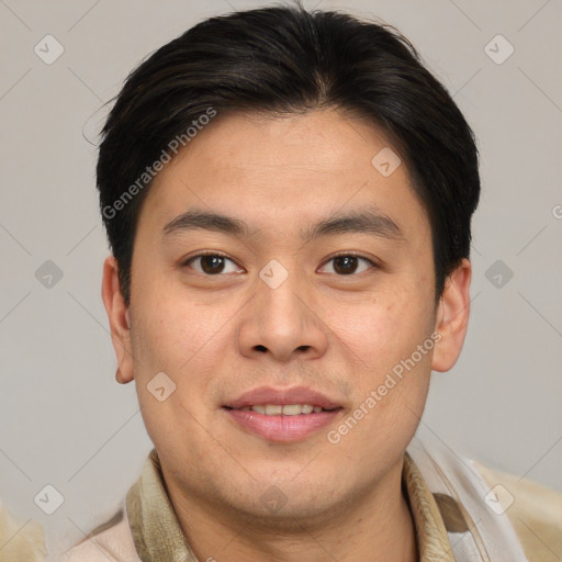 Joyful asian young-adult male with short  brown hair and brown eyes