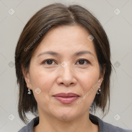 Joyful white adult female with medium  brown hair and brown eyes