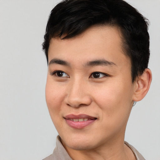 Joyful asian young-adult male with short  brown hair and brown eyes