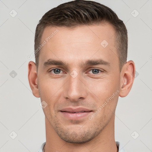 Joyful white young-adult male with short  brown hair and brown eyes