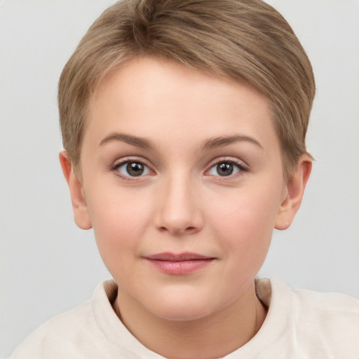 Joyful white child female with short  brown hair and brown eyes