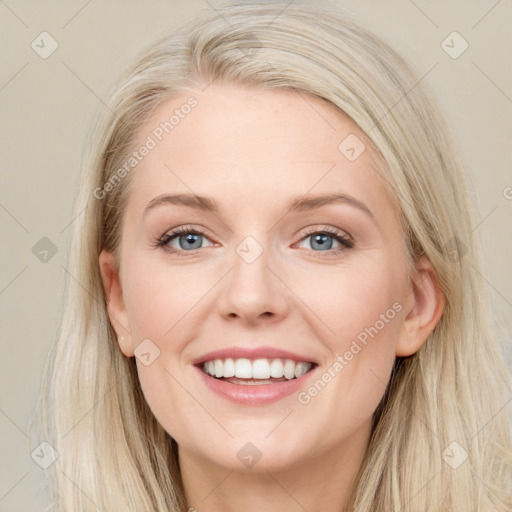 Joyful white young-adult female with long  brown hair and blue eyes