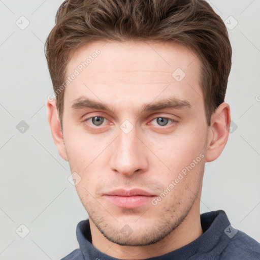 Neutral white young-adult male with short  brown hair and grey eyes