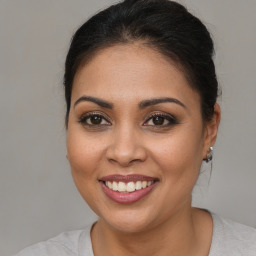 Joyful white young-adult female with medium  brown hair and brown eyes