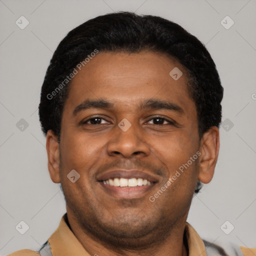 Joyful latino young-adult male with short  black hair and brown eyes