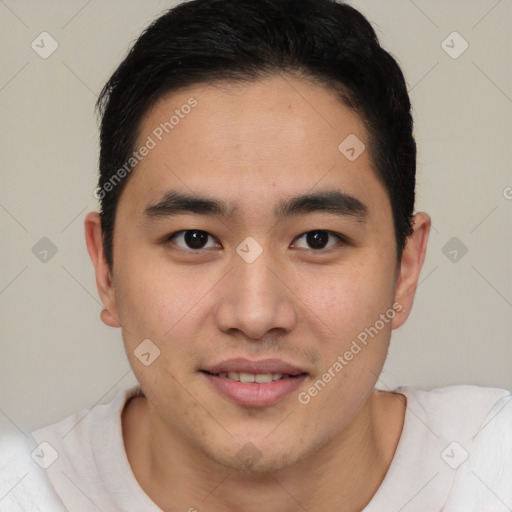 Joyful asian young-adult male with short  brown hair and brown eyes