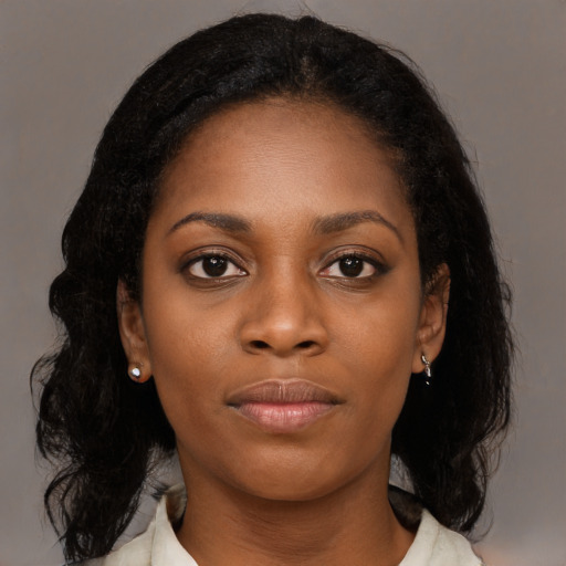 Joyful black young-adult female with medium  black hair and brown eyes