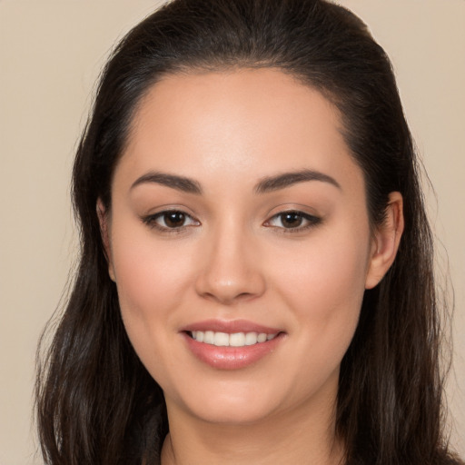 Joyful white young-adult female with long  brown hair and brown eyes