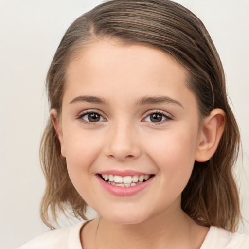 Joyful white child female with medium  brown hair and brown eyes