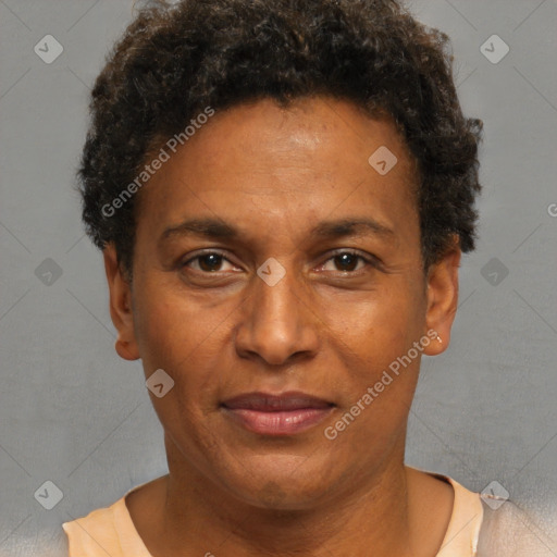 Joyful black adult male with short  brown hair and brown eyes