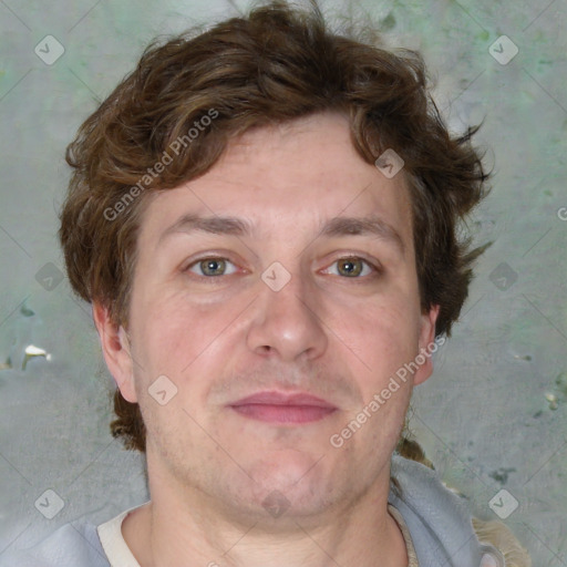 Joyful white adult male with short  brown hair and grey eyes