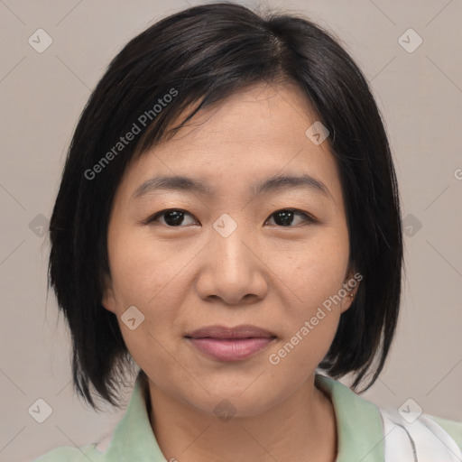 Joyful asian young-adult female with medium  brown hair and brown eyes