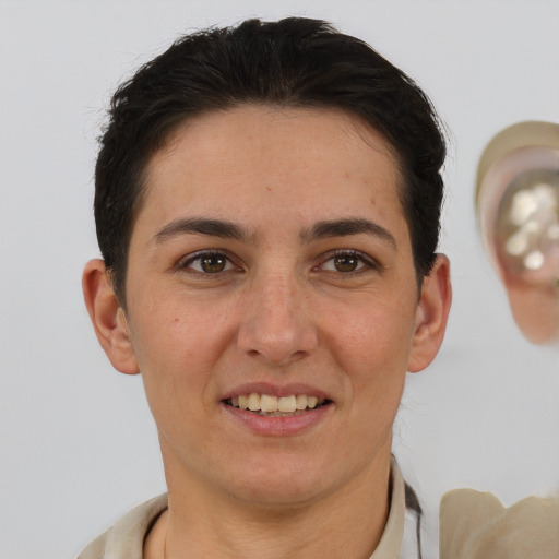 Joyful white young-adult female with short  brown hair and brown eyes