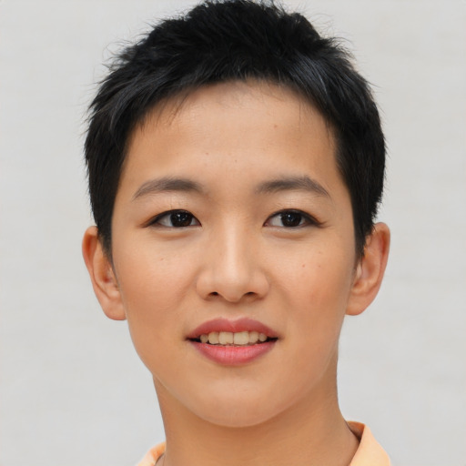 Joyful asian young-adult female with short  black hair and brown eyes