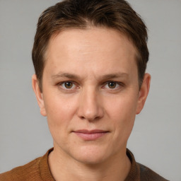 Joyful white young-adult female with short  brown hair and grey eyes