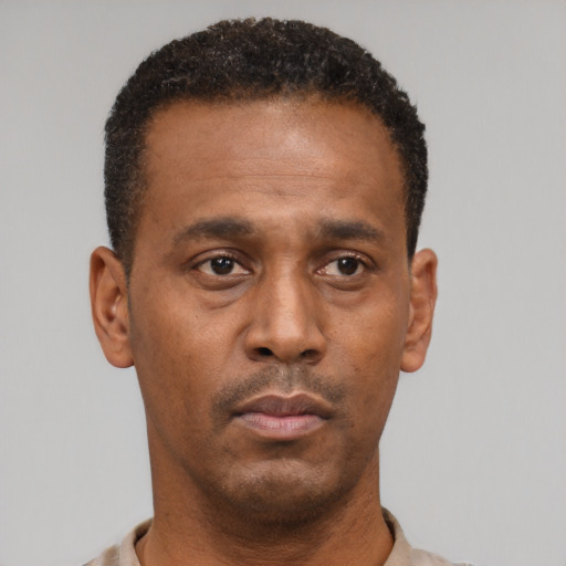 Neutral black adult male with short  black hair and brown eyes