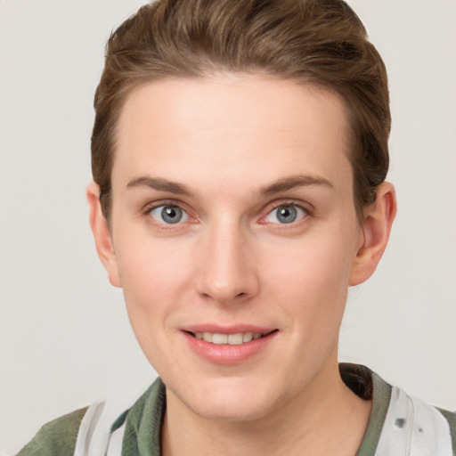 Joyful white young-adult female with short  brown hair and grey eyes