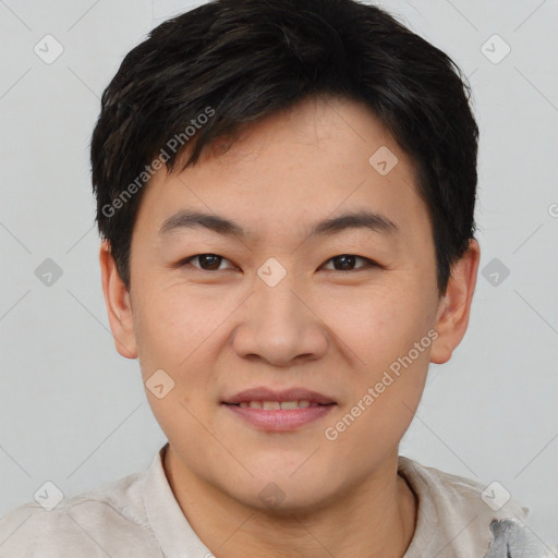 Joyful asian young-adult male with short  brown hair and brown eyes