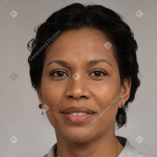 Joyful black adult female with short  black hair and brown eyes