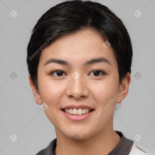 Joyful asian young-adult female with short  brown hair and brown eyes