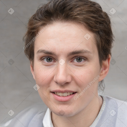 Joyful white adult female with short  brown hair and grey eyes