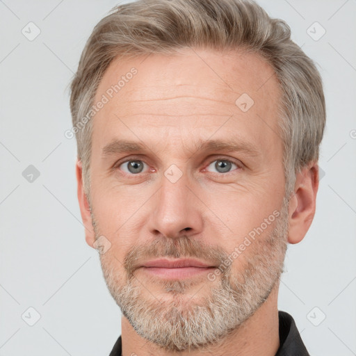 Neutral white adult male with short  brown hair and grey eyes