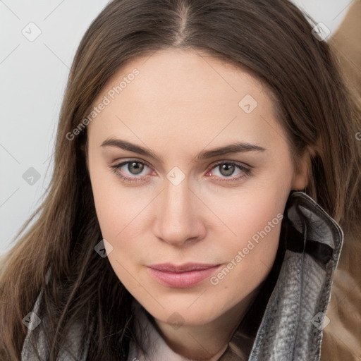 Neutral white young-adult female with long  brown hair and brown eyes