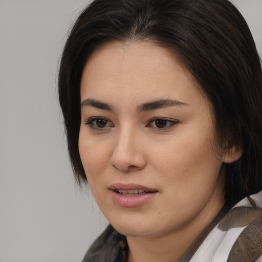 Joyful white young-adult female with medium  brown hair and brown eyes