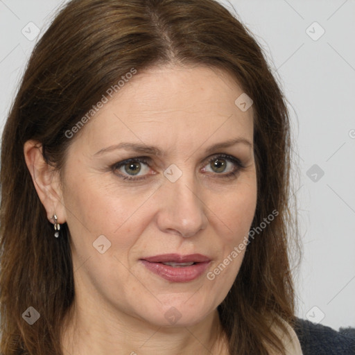 Joyful white adult female with long  brown hair and brown eyes