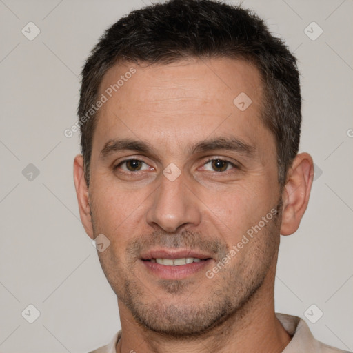 Joyful white adult male with short  brown hair and brown eyes