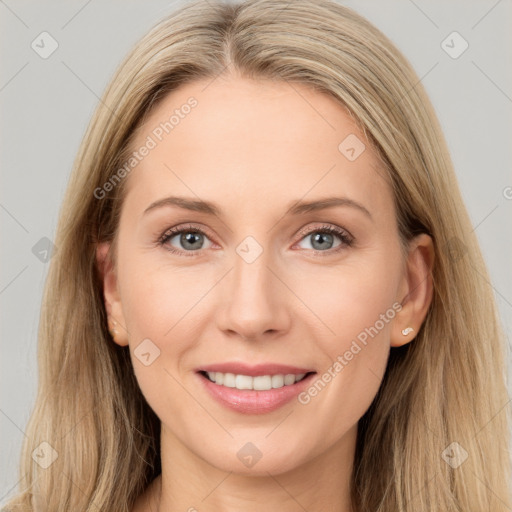 Joyful white young-adult female with long  brown hair and grey eyes