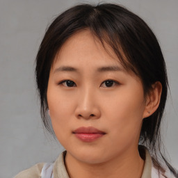 Neutral asian young-adult female with medium  brown hair and brown eyes