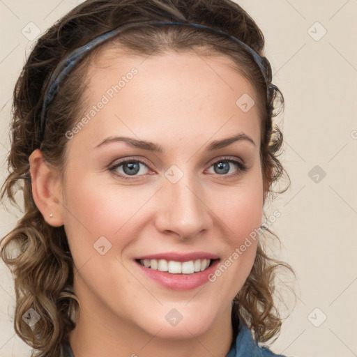 Joyful white young-adult female with long  brown hair and blue eyes