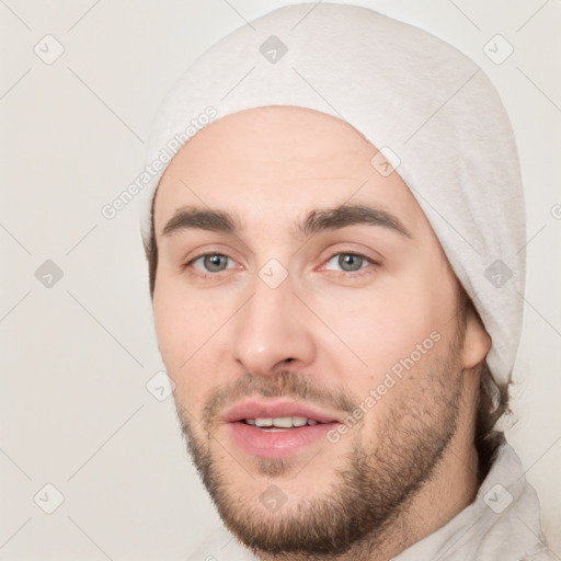 Joyful white young-adult male with short  black hair and brown eyes