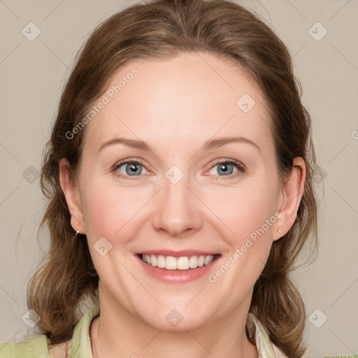 Joyful white young-adult female with medium  brown hair and blue eyes