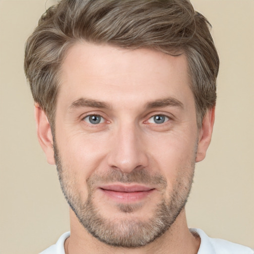 Joyful white adult male with short  brown hair and brown eyes