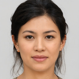 Joyful asian young-adult female with medium  brown hair and brown eyes