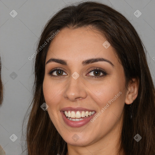 Joyful white young-adult female with long  brown hair and brown eyes