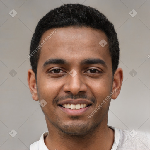 Joyful black young-adult male with short  black hair and brown eyes