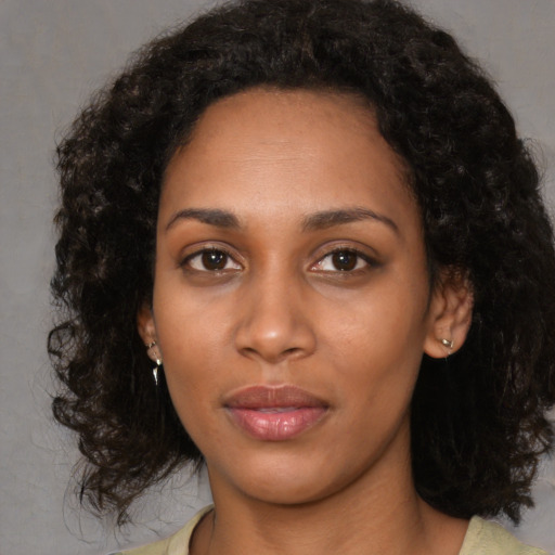 Neutral black young-adult female with medium  black hair and brown eyes