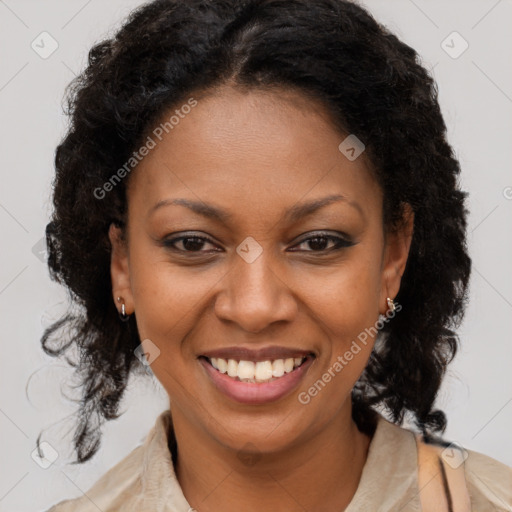 Joyful black young-adult female with long  brown hair and brown eyes