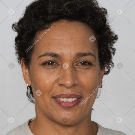 Joyful latino adult female with short  brown hair and brown eyes