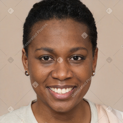 Joyful black young-adult female with short  brown hair and brown eyes