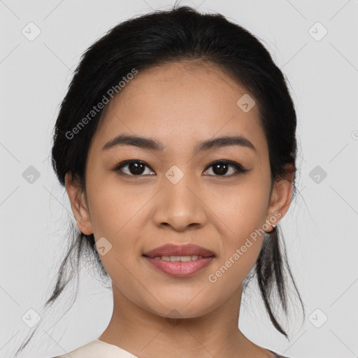 Joyful asian young-adult female with medium  black hair and brown eyes