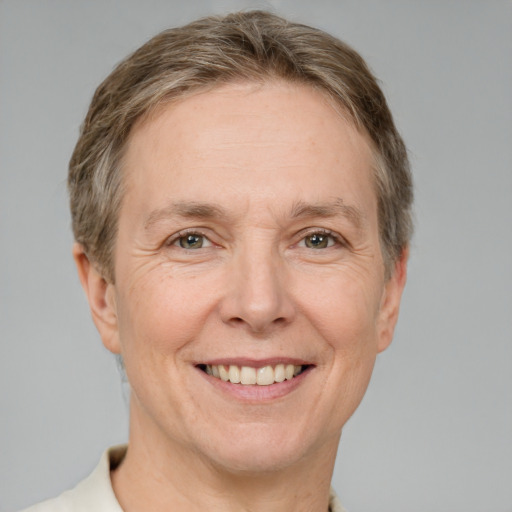 Joyful white adult female with short  brown hair and brown eyes