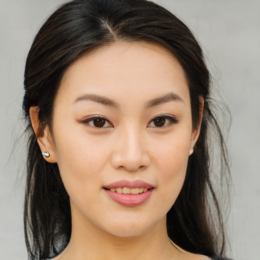 Joyful asian young-adult female with medium  brown hair and brown eyes