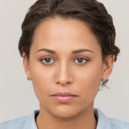 Neutral white young-adult female with short  brown hair and brown eyes